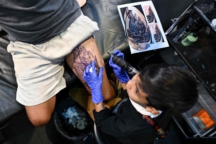 Napat Mitmakorn, a nine-year-old Thai child tattoo artist, at the 2025 Thailand Tattoo Expo in Bangkok. (AFP) Napat Mitmakorn, a nine-year-old Thai child tattoo artist, at the 2025 Thailand Tattoo Expo in Bangkok. (AFP)