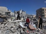 Palestinians inspect the rubble of the Elias Tarazi family house, after it was destroyed in an Israeli strike in al-Sabra neighbourhood in Gaza City on March 19, 2025. Palestinians inspect the rubble of the Elias Tarazi family house, after it was destroyed in an Israeli strike in al-Sabra neighbourhood in Gaza City on March 19, 2025.