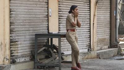 A woman police officer stands on vigil in Nagpur on Wednesday. (PTI) A woman police officer stands on vigil in Nagpur on Wednesday. (PTI)