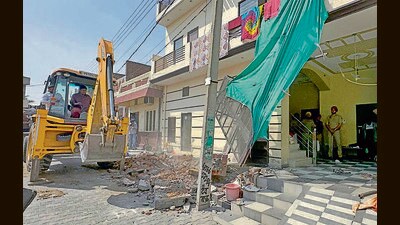 Khanna police and municipal council officials during the demolition in Payal sub-division on Wednesday. (HT Photo)