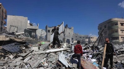 Palestinians inspect the rubble of the Elias Tarazi family house, after it was destroyed in an Israeli strike in al-Sabra neighbourhood in Gaza City on March 19, 2025. (Omar AL-QATTAA / AFP) Palestinians inspect the rubble of the Elias Tarazi family house, after it was destroyed in an Israeli strike in al-Sabra neighbourhood in Gaza City on March 19, 2025. (Omar AL-QATTAA / AFP)