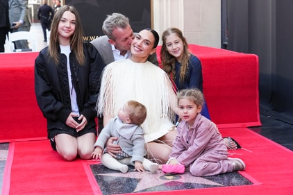 Alma Varsano, from left, Jaron Varsano, Ori Varsano, Gal Gadot, Maya Varsano, and Daniella Varsano pose with Gadot's new star during a ceremony on the Hollywood Walk of Fame on Tuesday, March 18, 2025, in Los Angeles. (Photo by Jordan Strauss/Invision/AP) (Jordan Strauss/Invision/AP) Alma Varsano, from left, Jaron Varsano, Ori Varsano, Gal Gadot, Maya Varsano, and Daniella Varsano pose with Gadot's new star during a ceremony on the Hollywood Walk of Fame on Tuesday, March 18, 2025, in Los Angeles. (Photo by Jordan Strauss/Invision/AP) (Jordan Strauss/Invision/AP)