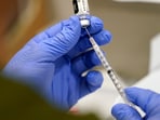 FILE - A healthcare worker fills a syringe with the Pfizer COVID-19 vaccine at Jackson Memorial Hospital on Oct. 5, 2021, in Miami. VAIDS is not a real condition, experts say. The co-authors of the study say their work is being misrepresented and doesn’t show that the vaccine is harmful to the immune system. The false claim is spreading as U.S. health officials recommend most Americans receive an updated COVID-19 vaccine. (AP Photo/Lynne Sladky, File) FILE - A healthcare worker fills a syringe with the Pfizer COVID-19 vaccine at Jackson Memorial Hospital on Oct. 5, 2021, in Miami. VAIDS is not a real condition, experts say. The co-authors of the study say their work is being misrepresented and doesn’t show that the vaccine is harmful to the immune system. The false claim is spreading as U.S. health officials recommend most Americans receive an updated COVID-19 vaccine. (AP Photo/Lynne Sladky, File)