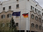 The German and European flags fly in front of the newly reopened German embassy in Damascus on March 20, 2025. Germany's Foreign Minister Annalena Baerbock officially reopened her country's embassy in war-ravaged Syria during a one-day visit to Damascus on March 20.