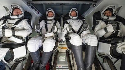 After landing in the water, Butch Wilmore, Alexander Gorbunov, Nick Hague and Sunita Williams sat in the SpaceX recovery ship Megan (NASA via AP) After landing in the water, Butch Wilmore, Alexander Gorbunov, Nick Hague and Sunita Williams sat in the SpaceX recovery ship Megan (NASA via AP)