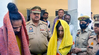 Police take away Merchant Navy officer Saurabh Rajput's wife Muskan and her lover Sahil Shukla after they were arrested in connection with his murder. (PTI) Police take away Merchant Navy officer Saurabh Rajput's wife Muskan and her lover Sahil Shukla after they were arrested in connection with his murder. (PTI)