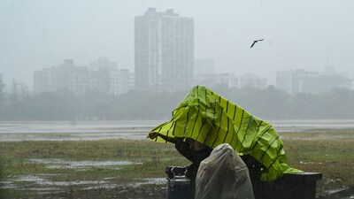 Tea sellers covered themselves with plastic sheets to protect from sudden rainfall at Maidan area in Kolkata, India. (File) (Photo by Samir Jana/ Hindustan Times) Tea sellers covered themselves with plastic sheets to protect from sudden rainfall at Maidan area in Kolkata, India. (File) (Photo by Samir Jana/ Hindustan Times)