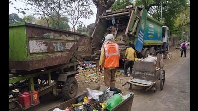 Sanitation workers picking up waste from a collection centre in Prayagraj on Thursday (HT Photo) Sanitation workers picking up waste from a collection centre in Prayagraj on Thursday (HT Photo)