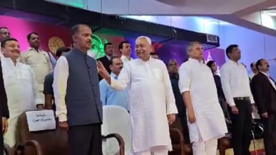Bihar chief minister Nitish Kumar taps his principal secretary’s shoulder during the national anthem at a sports event in Patna. (Screengrab ) Bihar chief minister Nitish Kumar taps his principal secretary’s shoulder during the national anthem at a sports event in Patna. (Screengrab )