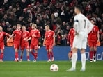 Portugal's forward Cristiano Ronaldo (front R) reacts as Denmark's players celebrate. Portugal's forward Cristiano Ronaldo (front R) reacts as Denmark's players celebrate.
