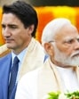 Former Canadian PM Justin Trudeau walks past Prime Minister Narendra Modi during the G20 Summit in New Delhi in September 2023. (AP File Photo)