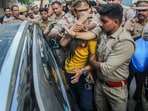 Police intervene as lawyers trash accused Sahil Shukla while he was being produced in a court in connection with Merchant Navy officer Saurabh Rajput's killing, in Meerut, Wednesday, March 19, 2025