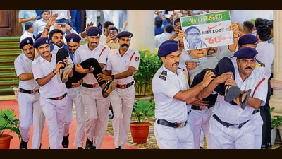 BJP MLAs being evicted by Marshals during the Budget session of Karnataka Assembly, in Bengaluru, Friday, March 21, 2025. Eighteen BJP MLAs were suspended for six months from the Legislative Assembly on Friday for "disrespecting" Speaker U T Khader. (PTI) BJP MLAs being evicted by Marshals during the Budget session of Karnataka Assembly, in Bengaluru, Friday, March 21, 2025. Eighteen BJP MLAs were suspended for six months from the Legislative Assembly on Friday for "disrespecting" Speaker U T Khader. (PTI)