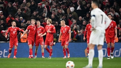 Portugal's forward Cristiano Ronaldo (front R) reacts as Denmark's players celebrate. (AFP) Portugal's forward Cristiano Ronaldo (front R) reacts as Denmark's players celebrate. (AFP)