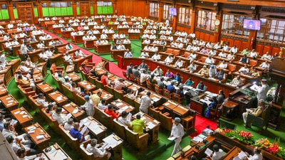 The Bharatiya Janata Party (BJP), which is in the opposition in Karnataka, stormed the well of the house raising slogans (PTI) The Bharatiya Janata Party (BJP), which is in the opposition in Karnataka, stormed the well of the house raising slogans (PTI)