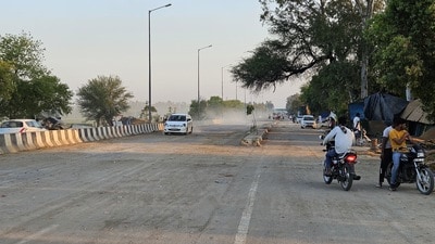 Motorists play on the National Highway 52 at Khanauri on Friday. Motorists play on the National Highway 52 at Khanauri on Friday.