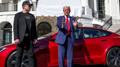 US President Donald Trump talks to the media next to Tesla CEO Elon Musk (REUTERS)