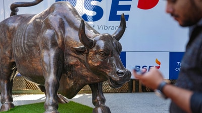 Sensex, Nifty 50 today: A man walks past the bull statue at BSE building in Mumbai. (PTI) Sensex, Nifty 50 today: A man walks past the bull statue at BSE building in Mumbai. (PTI)