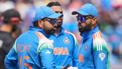 Virat Kohli talks to India captain Rohit Sharma (PTI) Virat Kohli talks to India captain Rohit Sharma (PTI)