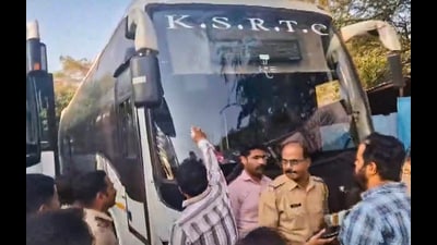 Shiv Sena workers blacken a bus bearing Karnataka number plates after Marathi drivers were allegedly assaulted on February 23. (PTI) Shiv Sena workers blacken a bus bearing Karnataka number plates after Marathi drivers were allegedly assaulted on February 23. (PTI)