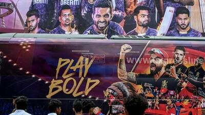 Supporters gather to catch a glimpse of RCB players as a bus carrying them enters the Eden Gardens on the eve of IPL 2025. (AFP) Supporters gather to catch a glimpse of RCB players as a bus carrying them enters the Eden Gardens on the eve of IPL 2025. (AFP)