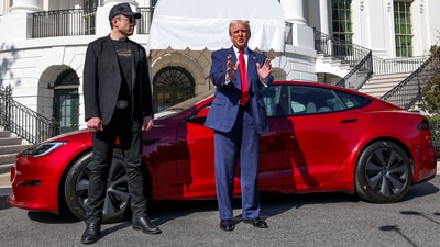 US President Donald Trump talks to the media next to Tesla CEO Elon Musk. (Reuters file photo)