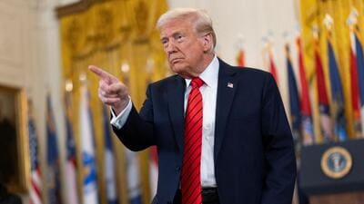US President Donald Trump gestures during the signing event for an executive order to shut down the Department of Education in Washington, D.C., on March 20. (REUTERS) US President Donald Trump gestures during the signing event for an executive order to shut down the Department of Education in Washington, D.C., on March 20. (REUTERS)