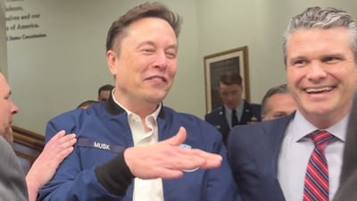 Elon Musk and U.S. Defence Secretary Pete Hegseth laugh at the Pentagon in Washington, D.C., U.S., March 21, 2025 in this screengrab obtained from a video. REUTERS/Idrees Ali (REUTERS)