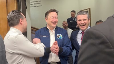 Elon Musk and U.S. Defence Secretary Pete Hegseth laugh at the Pentagon in Washington, D.C., U.S., March 21, 2025 in this screengrab obtained from a video. REUTERS/Idrees Ali (REUTERS)