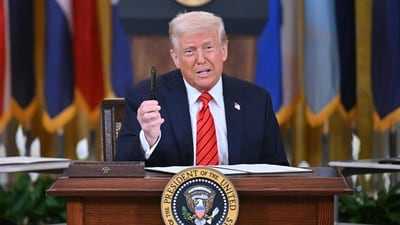 US President Donald Trump holds up a pen as he signs an executive order during an education event in the East Room of the White house in Washington, DC, March 20, 2025. (AFP) US President Donald Trump holds up a pen as he signs an executive order during an education event in the East Room of the White house in Washington, DC, March 20, 2025. (AFP)