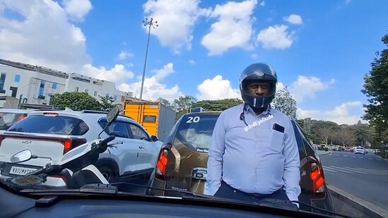 Man in Bengaluru blocked the road after brawl with a car driver. (X/ThirdEyeDude)
