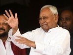 Bihar CM Nitish Kumar was criticised by the RJD for talking and gesturing while the national anthem played during an event.
