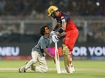Fan breaches security, enters field of play to touch Virat Kohli's feet. 