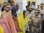Police take away Merchant Navy officer Saurabh Rajput's wife Muskaan and her lover Sahil Shukla after they were arrested in connection with his murder, in Meerut, on March 19, 2025. 