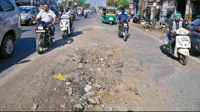 A local says MC opened manholes for repairs near Pratap Chowk two weeks ago, but they have not been levelled so far. (Manish/HT)
