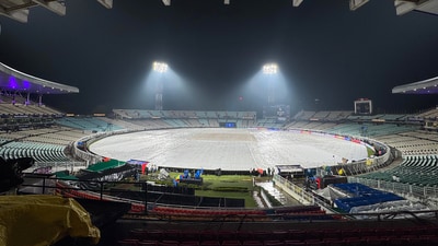 Covers had to be put on the Eden Gardens Stadium ground due to rain on the eve of the IPL 2025 KKR vs RCB opening match. (ANI) Covers had to be put on the Eden Gardens Stadium ground due to rain on the eve of the IPL 2025 KKR vs RCB opening match. (ANI)