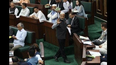 BJP MLA Sham Lal Sharma stages a walkout from the Jammu and Kashmir Assembly during the Budget session, in Jammu, on Saturday. (PTI)