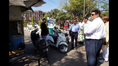 Chandigarh civic body officials during checking of parking sites on Friday. (HT Photo)