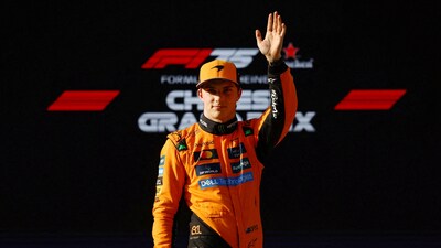McLaren's Oscar Piastri celebrates after qualifying in pole position (REUTERS)