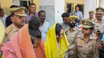 Meerut murder: Police take away Merchant Navy officer Saurabh Rajput's wife Muskan and her lover Sahil Shukla after they were arrested in connection with his murder. (PTI file photo) Meerut murder: Police take away Merchant Navy officer Saurabh Rajput's wife Muskan and her lover Sahil Shukla after they were arrested in connection with his murder. (PTI file photo)