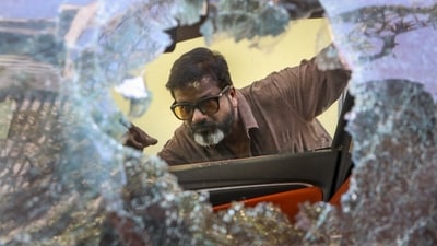 A local looks at a vandalised car, a day after violence broke out following an agitation by a right-wing group demanding the removal of Aurangzeb's tomb in Nagpur on March 17, 2025. (PTI) A local looks at a vandalised car, a day after violence broke out following an agitation by a right-wing group demanding the removal of Aurangzeb's tomb in Nagpur on March 17, 2025. (PTI)