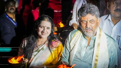Karnataka Deputy Chief Minister D K Shivakumar with wife Usha offers prayers during 'Cauvery Aarti'  (PTI)