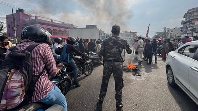 Tribal people block the Ranchi-Jamshedpur road during Ranchi bandh in protest against the construction of a flyover near a Sarna Sthal, a sacred tribal religious site. (PTI)