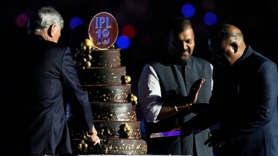 BCCI president Roger Binny and secretary Devajit Saikia cut take IPL 18 cake during the opening ceremony. (AP Image) BCCI president Roger Binny and secretary Devajit Saikia cut take IPL 18 cake during the opening ceremony. (AP Image)