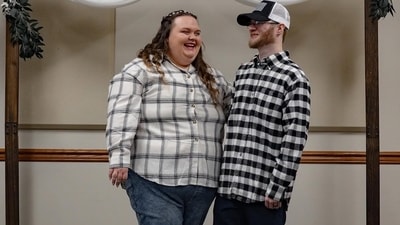 A US couple's $1,000 budget wedding, featuring jeans and plaid shirts, went viral, sparking backlash. (Instagram/amiebarron126) A US couple's $1,000 budget wedding, featuring jeans and plaid shirts, went viral, sparking backlash. (Instagram/amiebarron126)