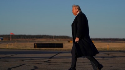 US. President Donald Trump walks at Morristown Municipal Airport, New Jersey (REUTERS)