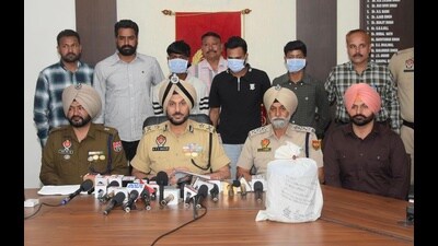 A narco-terror module and a cross-border drug cartel were busted in Amritsar with the arrest of eight persons in two cases, police said on Sunday. (HT Photo) A narco-terror module and a cross-border drug cartel were busted in Amritsar with the arrest of eight persons in two cases, police said on Sunday. (HT Photo)