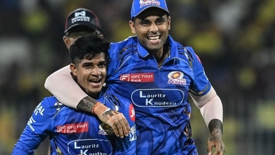 Mumbai Indians' Vignesh Puthur (L) celebrates with his captain Suryakumar Yadav after taking the wicket of Chennai Super Kings' Shivam Dube (AFP) Mumbai Indians' Vignesh Puthur (L) celebrates with his captain Suryakumar Yadav after taking the wicket of Chennai Super Kings' Shivam Dube (AFP)