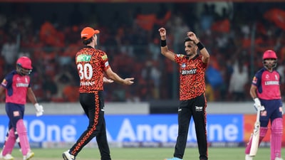  Sunrisers Hyderabad's Harshal Patel celebrates with Pat Cummins the wicket of Rajasthan Royals' Sanju Samson. Harshal was the pick of the SRH bowlers as he came up with a spell of 2/34 to help the hosts win the contest.  (REUTERS)