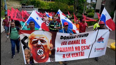 Demonstrators hold a banner reading “The Panama Canal is Not For Sale” with a picture of US President Donald Trump with a swastika during a protest in Panama City on January 20, 2025 (Photograph for representative purpose only). (AFP)